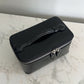 Bolso de maquillaje Maison Caviar Vanity Bag con cierre y compartimentos internos visibles en imagen.