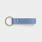 Llavero Maison Caviar Capri en color azul bebé, diseño elegante y compacto para llaves y accesorios.