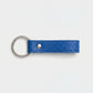 Llavero azul marino Maison Caviar con diseño elegante y detalles en metal, ideal para llaves y accesorios.