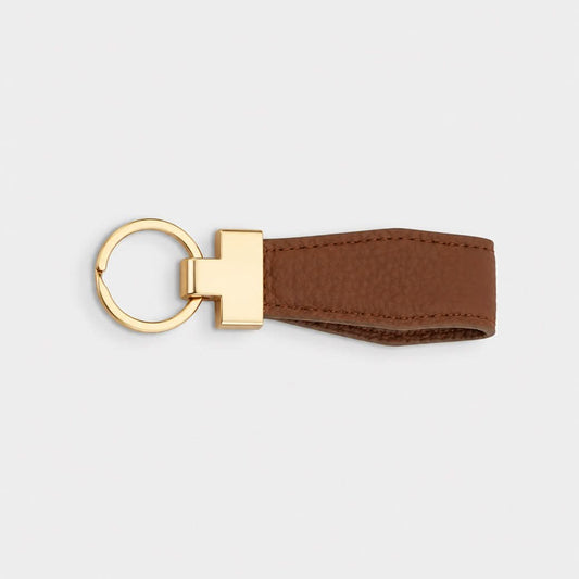 Llavero Maison Caviar Denver en color camel, con diseño elegante y detalles de alta calidad, para accesorios de moda.