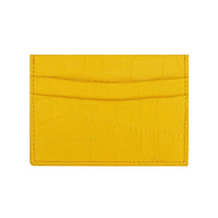 Tarjetero amarillo Maison Caviar Cannes, hecho de cuero, con múltiples ranuras para tarjetas y diseño elegante.