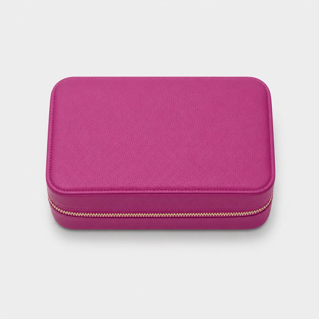 Joyero Maison Caviar Londres en color fucsia, con compartimentos y diseño elegante para joyas y accesorios.