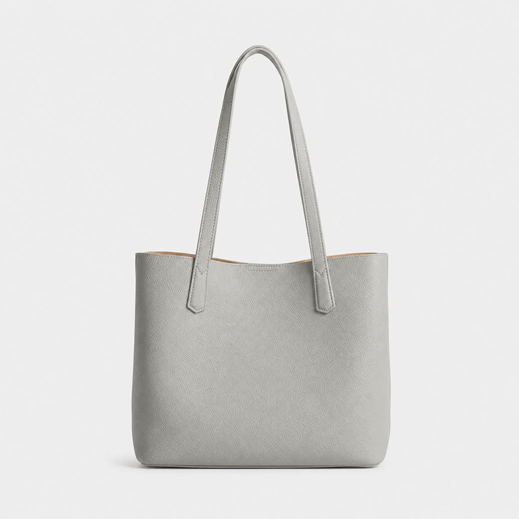 Bolso gris Maison Caviar de la colección bolsos Francesca, con diseño elegante y detalles en cuero.