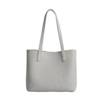 Bolso gris Maison Caviar de la colección bolsos Francesca, con diseño elegante y detalles en cuero.