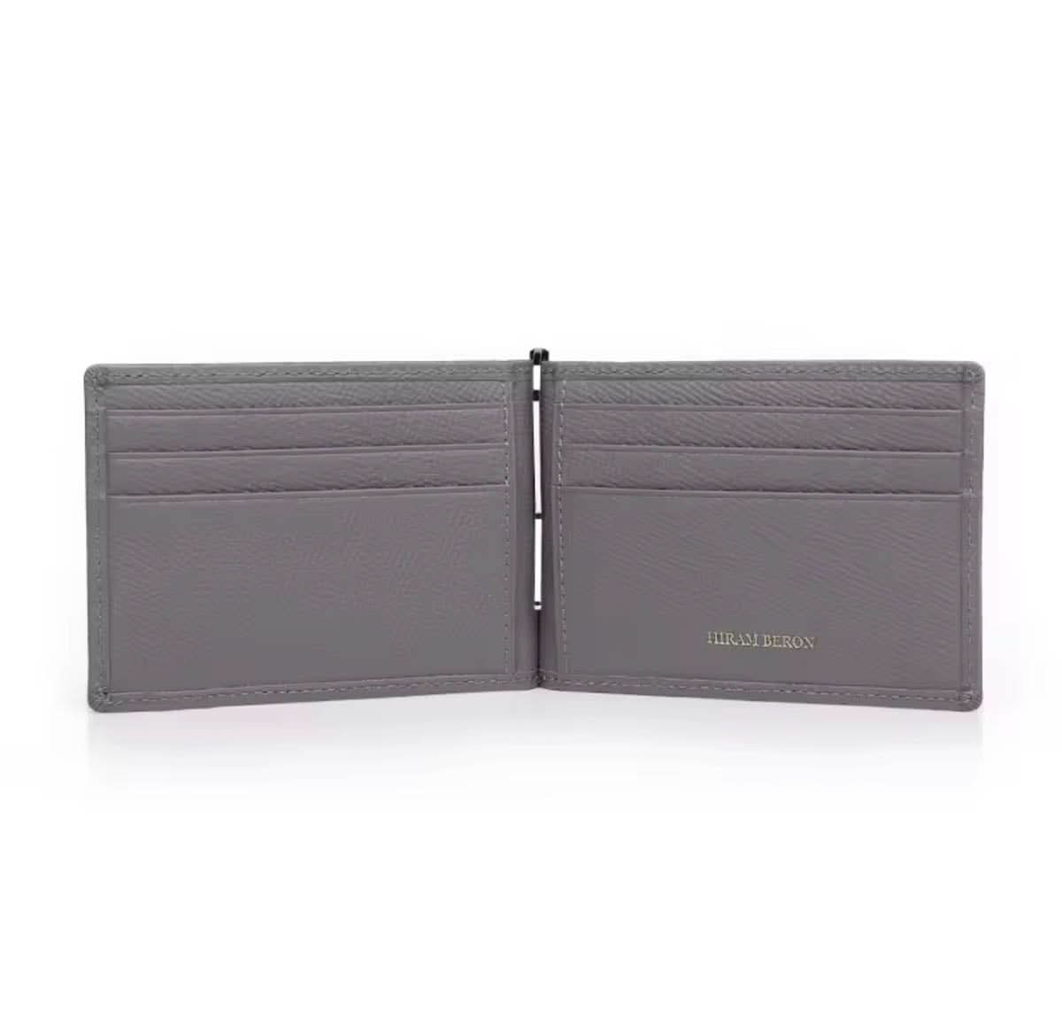 Billetera Dante de Maison Caviar en cuero negro con detalles elegantes y compartimentos para tarjetas y billetes.