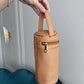 Pañalera Maison Caviar Carter con múltiples compartimentos y asas para llevar cómoda y con estilo.