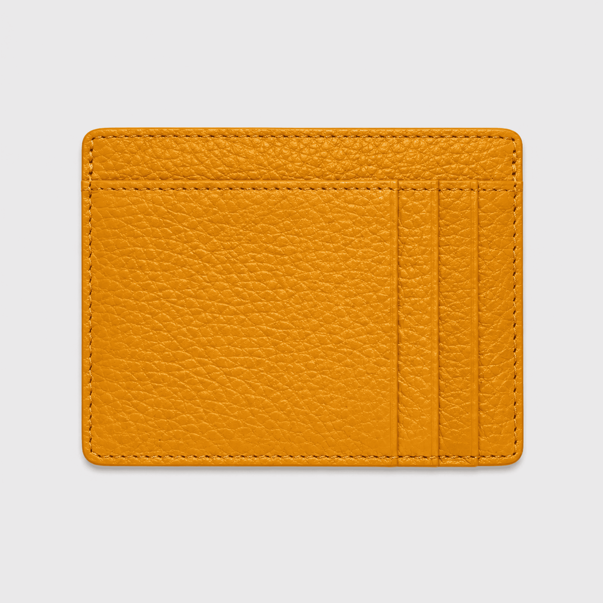 Billetera Maison Caviar Lisboa en color mostaza, con diseño elegante y cierre compacto para tarjetas y dinero.