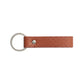 Llavero Maison Caviar Capri de color naranja con diseño elegante y detalles en textura, ideal para llaves o accesorios.