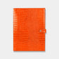 Funda para iPad Maison Caviar Mojacar de color naranja, protección y estilo para tableta en imagen.