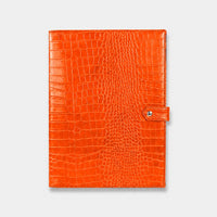 Funda para iPad Maison Caviar Mojacar de color naranja, protección y estilo para tableta en imagen.