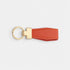 Llavero Maison Caviar Denver de color naranja con diseño elegante, ideal para llaves y accesorios de moda.