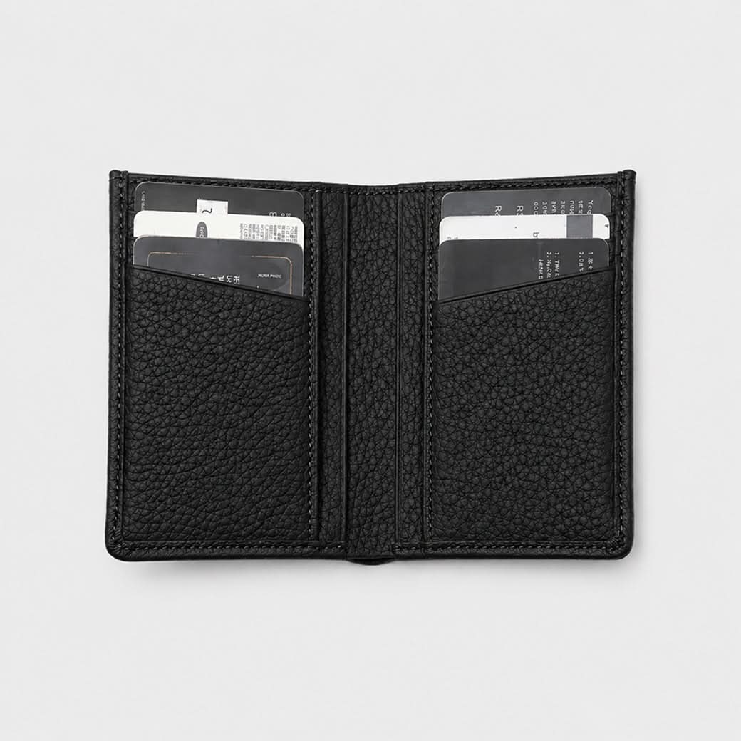 Billetera negra Maison Caviar Alphonse de cuero con diseño elegante y espacio para tarjetas y billetes.