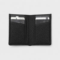 Billetera negra Maison Caviar Alphonse de cuero con diseño elegante y espacio para tarjetas y billetes.