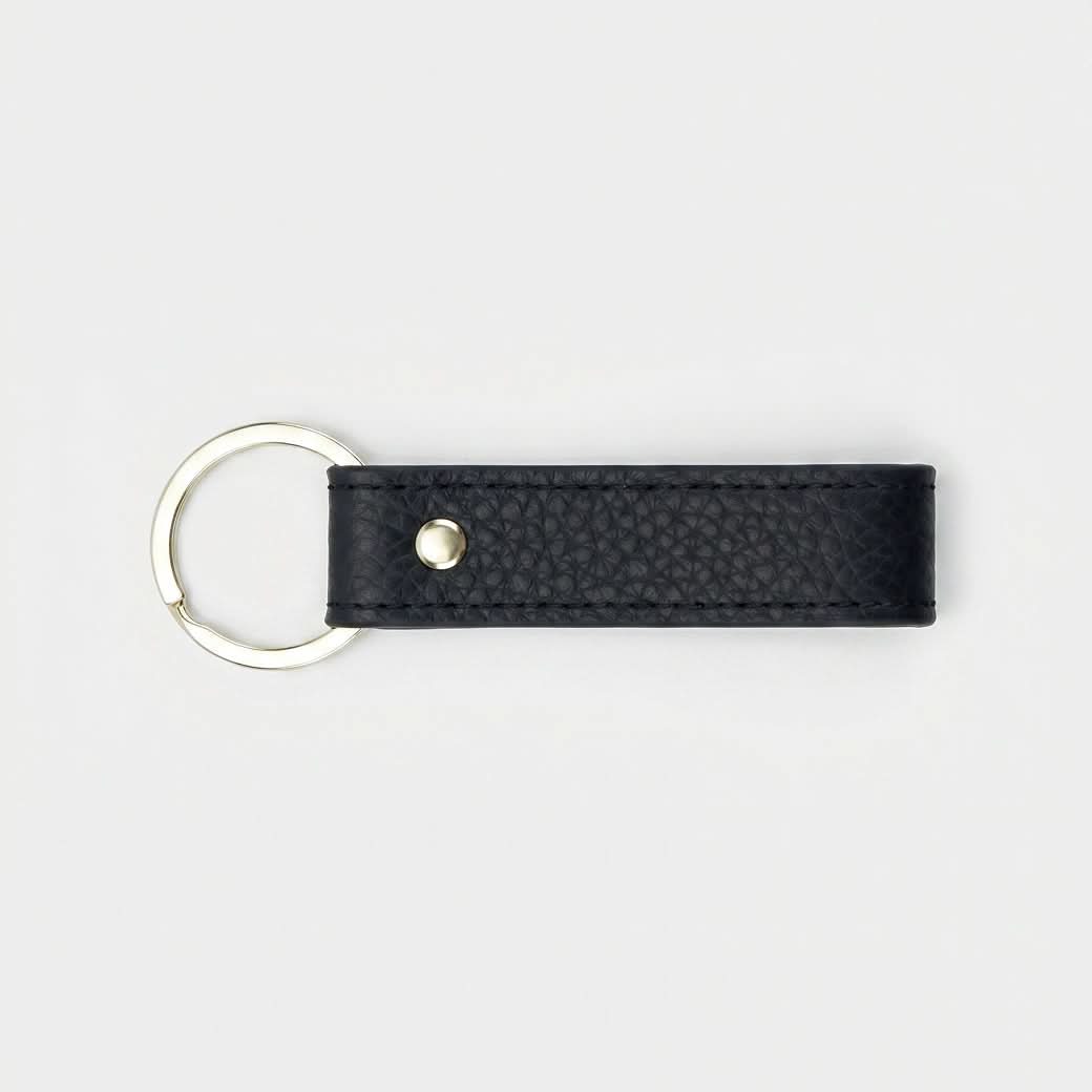 Llavero negro Maison Caviar Capri con diseño elegante y detalles en cuero, ideal para llaves y accesorios.