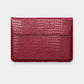 Funda para MacBook Maison Caviar Nobu de color rojo con textura crujiente y diseño elegante, protege y decora tu portátil.