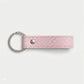 Llavero de Maison Caviar en color rosado, con diseño elegante y detalles en metal, ideal para llevar llaves con estilo.