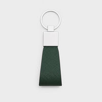 Llavero verde de Maison Caviar con diseño elegante y detalles en acabado brillante para llaves y accesorios.